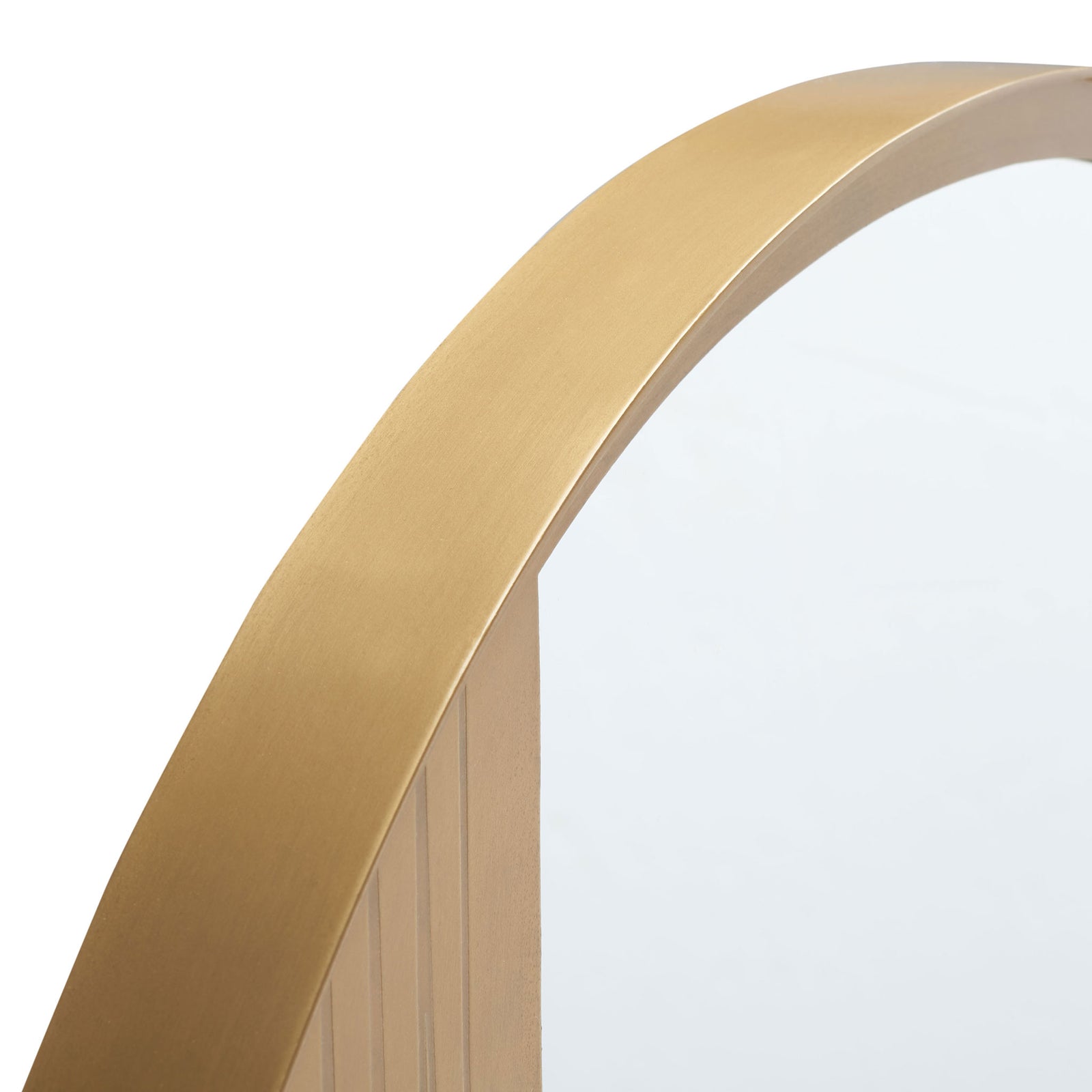 A curved antique brass frame borders the reflective glass beside finely grooved accents. || MRR3050A || detail_studio