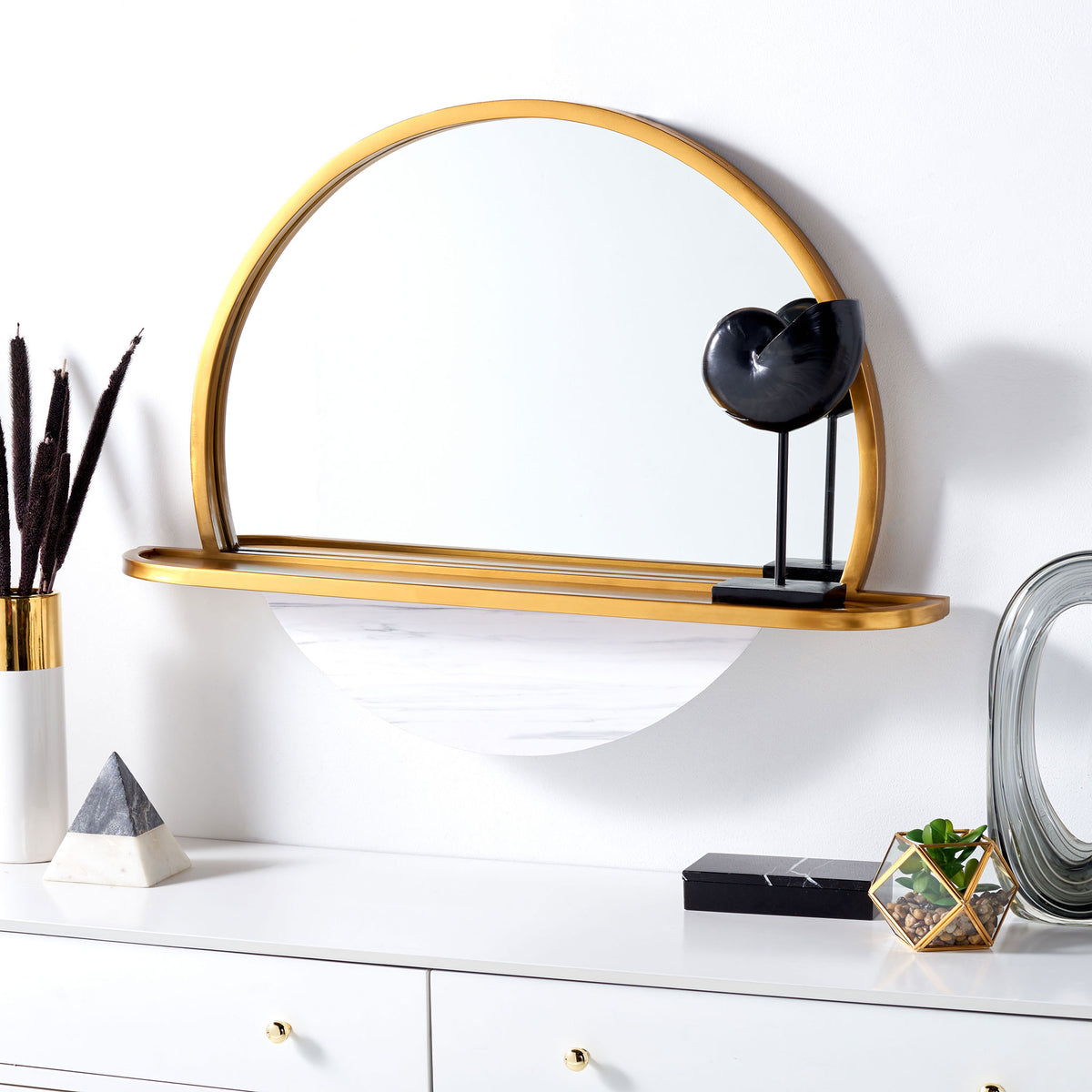A gold-framed arched mirror and display shelf brighten the wall above a dresser || MRR3057A || front_room