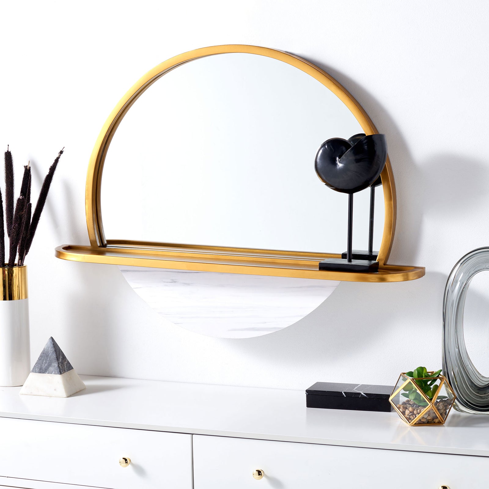 A gold-framed arched mirror and display shelf brighten the wall above a dresser || MRR3057A || front_room