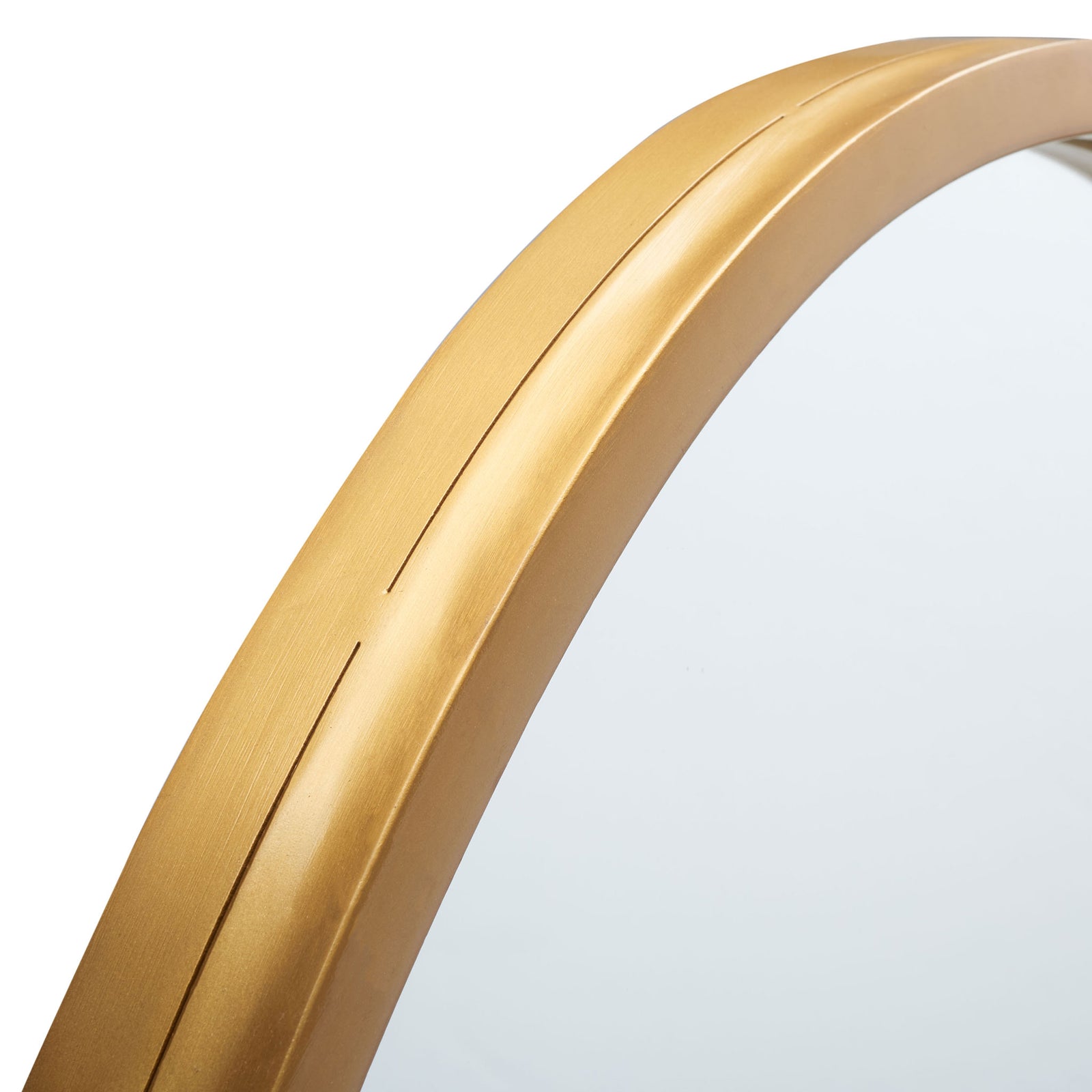 Curved gold metal trim outlines the reflective glass with a warm, smooth finish || MRR3058A || detail_studio