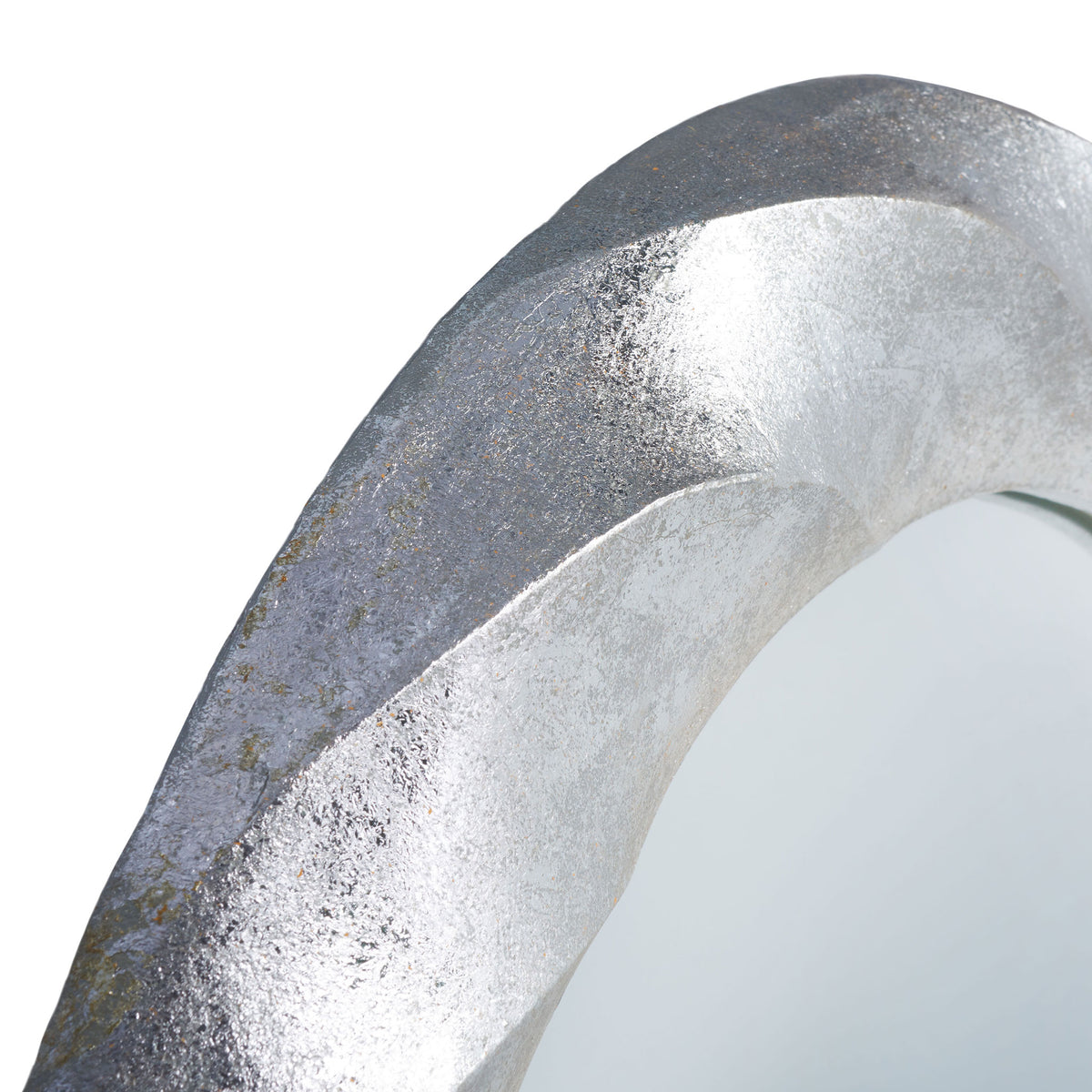 Textured silver bands sweep around the mirror's edge with a softly mottled finish. || MRR3059A || detail_studio