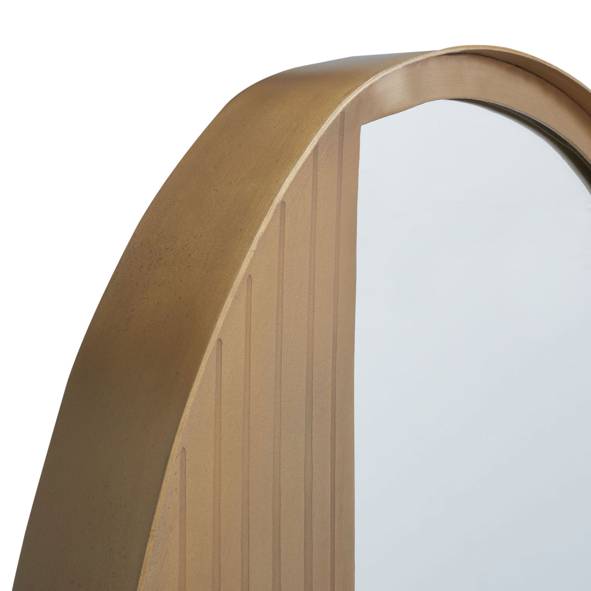 Fine grooves sweep along the curved antique brass-finish frame beside reflective glass