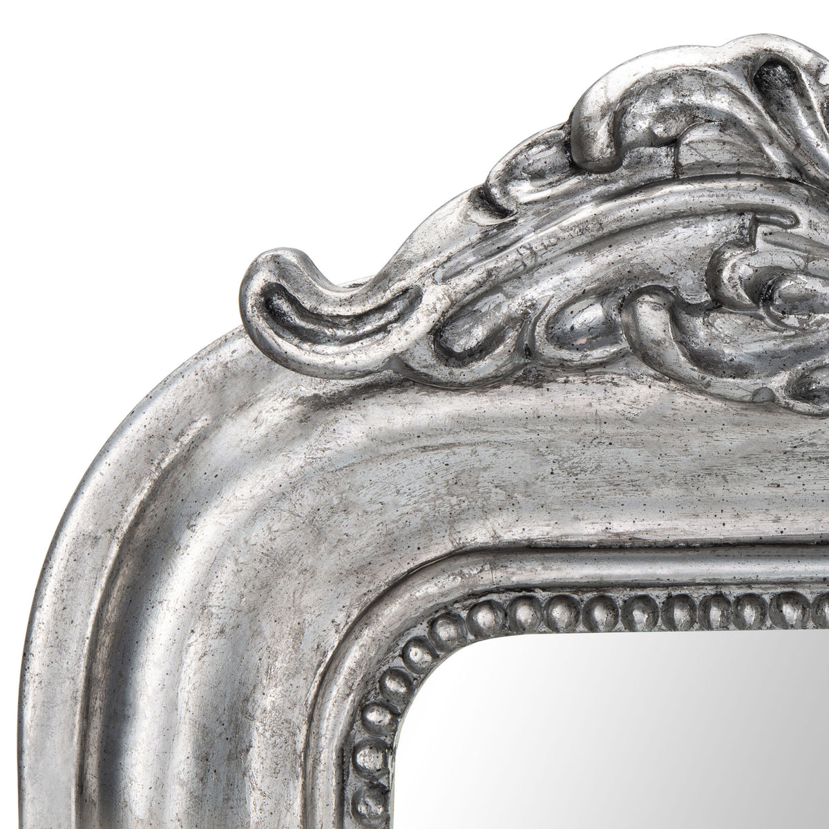 Antique silver scrollwork and a beaded inner edge bring rich texture to the mirror frame || MRR5000B || detail_studio