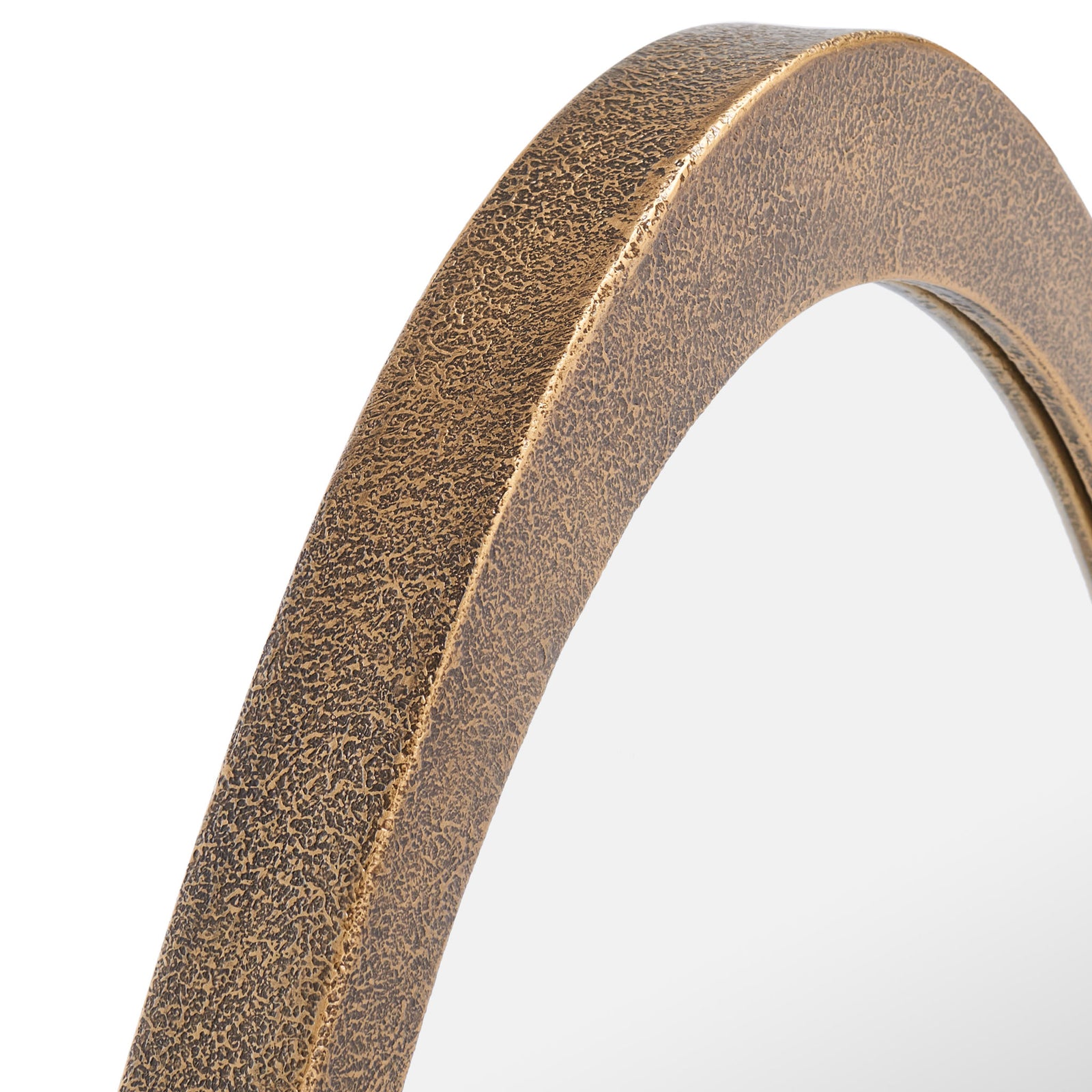 A richly textured brass frame brings warm, mottled detail to the oval mirror. || MRR8002B || detail_studio