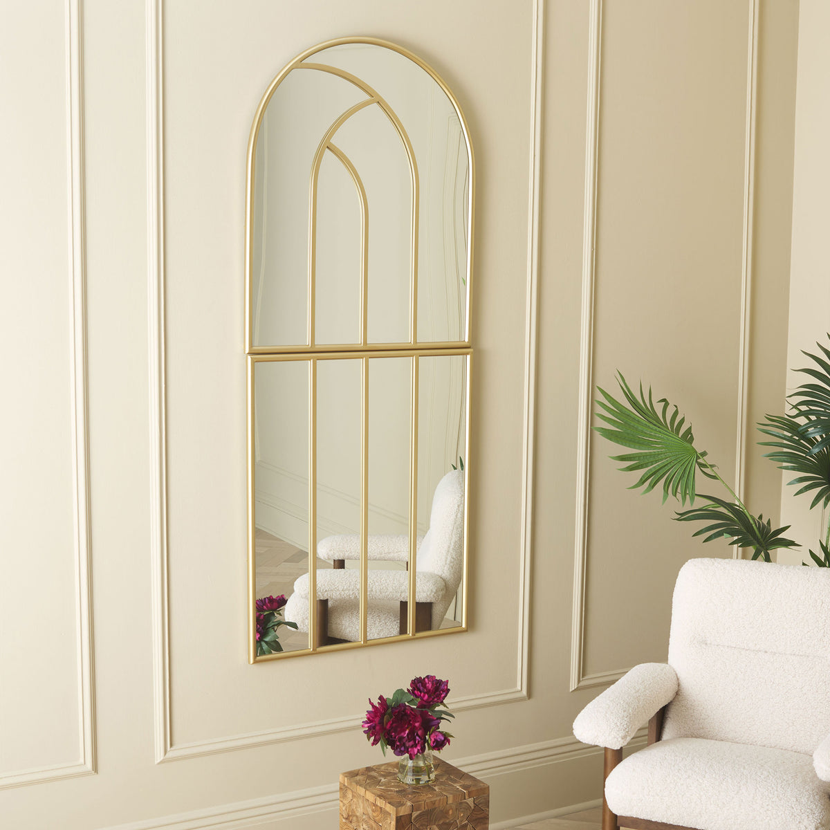 Arched gold mirror adds light and graceful lines to a paneled living room wall || MRR8006A || front_room