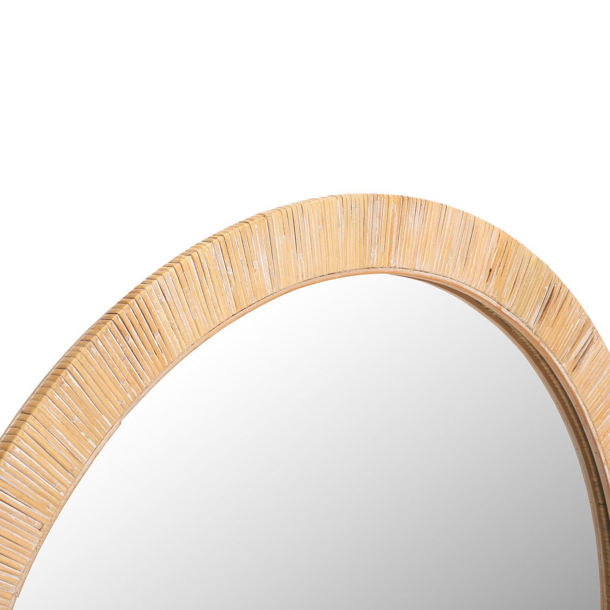 Natural vine strands add intricate texture to the mirror's warm-toned frame.