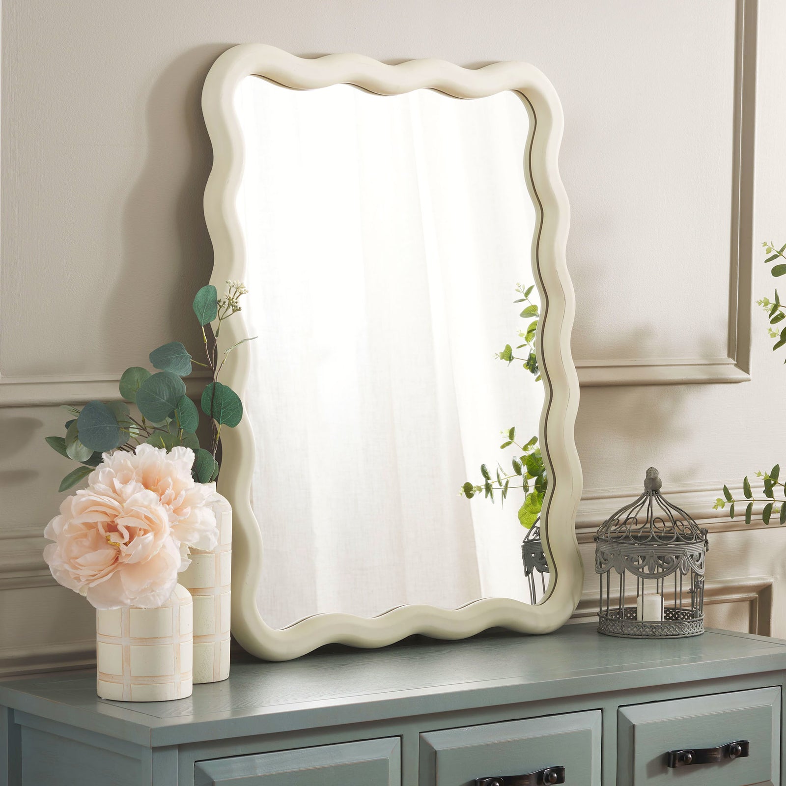 Wavy white mirror brightens the space above a blue-gray console || MRR9007A || front_angle_room