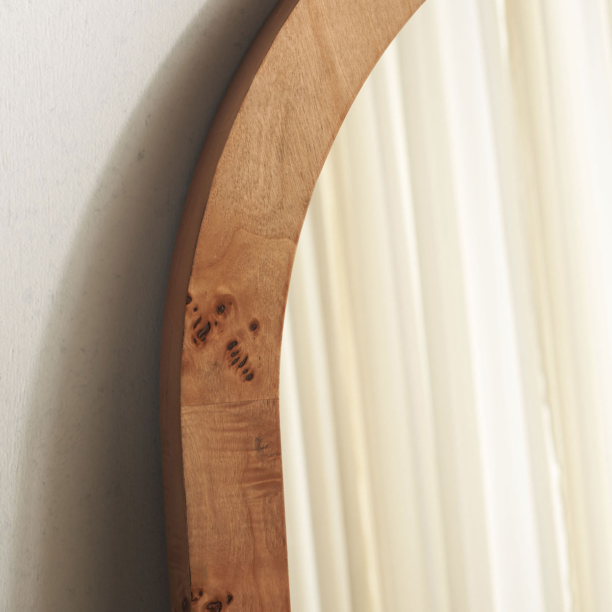 Rich wood grain and natural knots bring character to the curved mirror frame || MRR9013A || detail_room