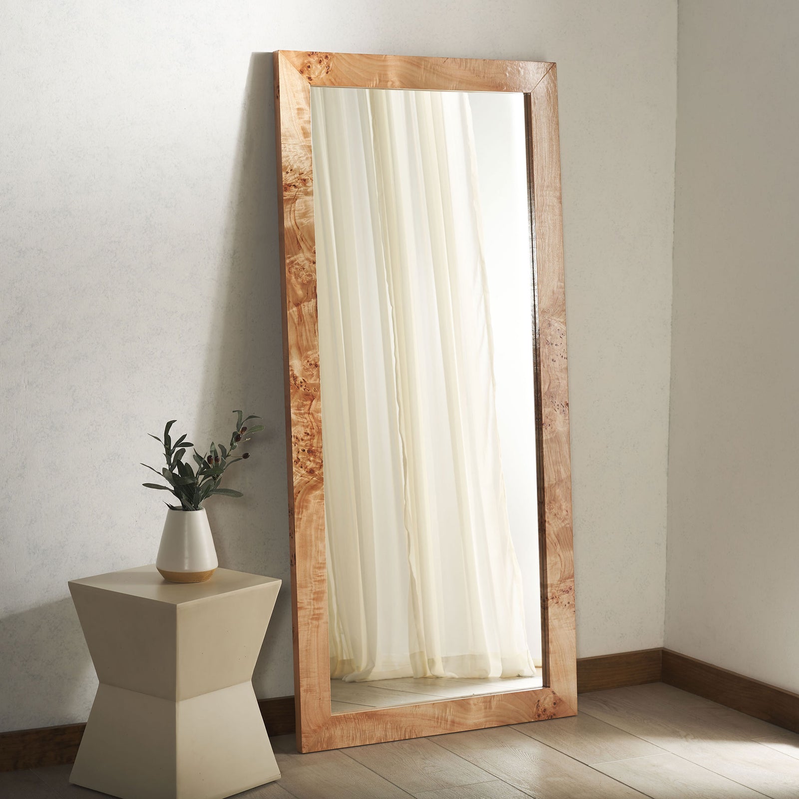 Light wood-framed mirror reflects soft drapery and brings natural warmth to the room. || MRR9014A || front_room