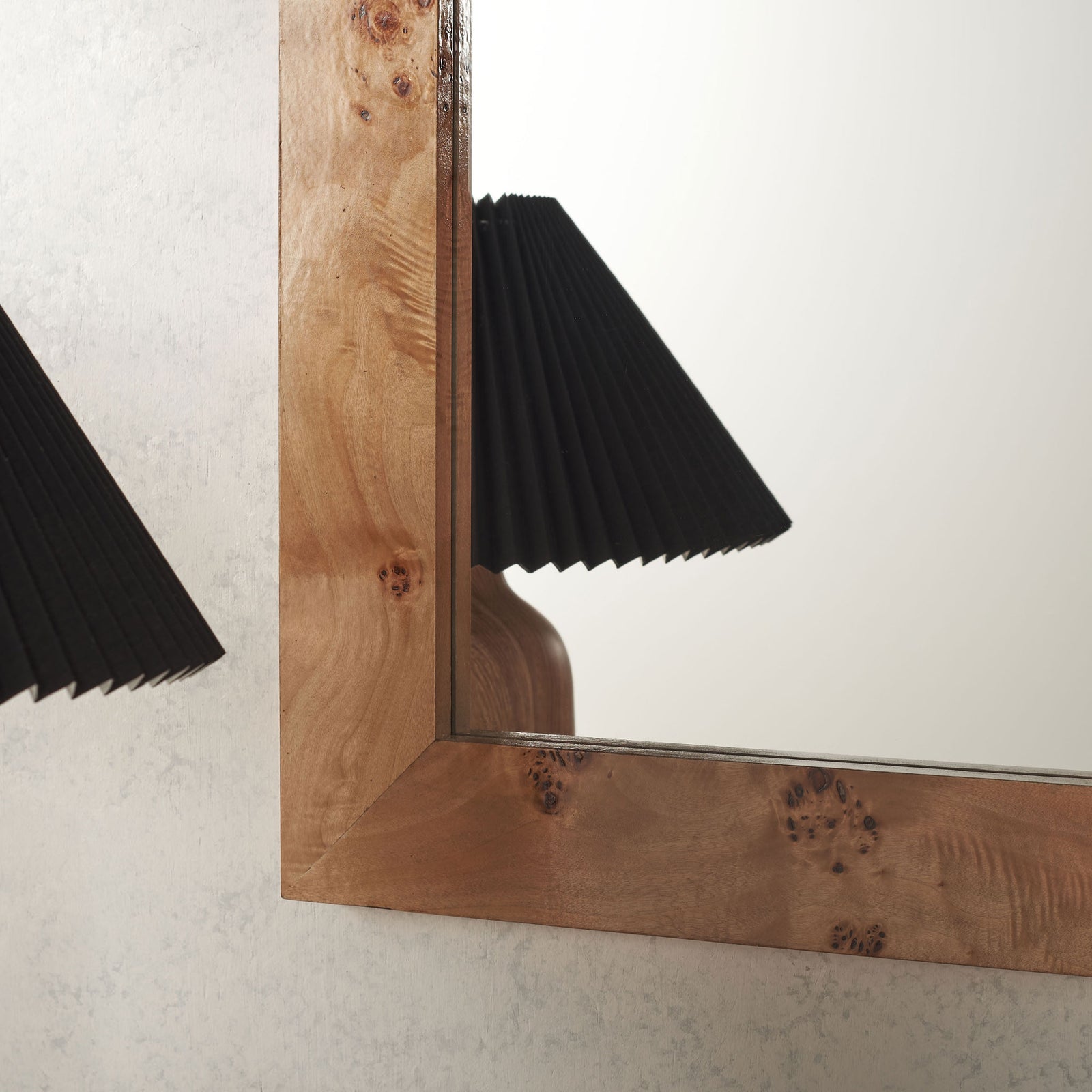 Rich knots and a mitered corner bring natural texture to the mirror's wide wood frame. || MRR9015A || detail_room