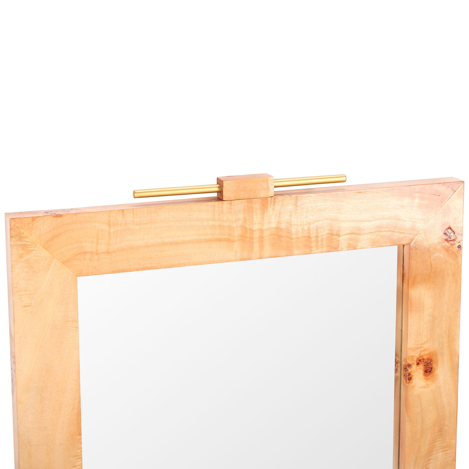 A slim gold-tone metal bar tops the mirror's light wood frame, highlighting its flowing grain. || MRR9015A || detail_studio