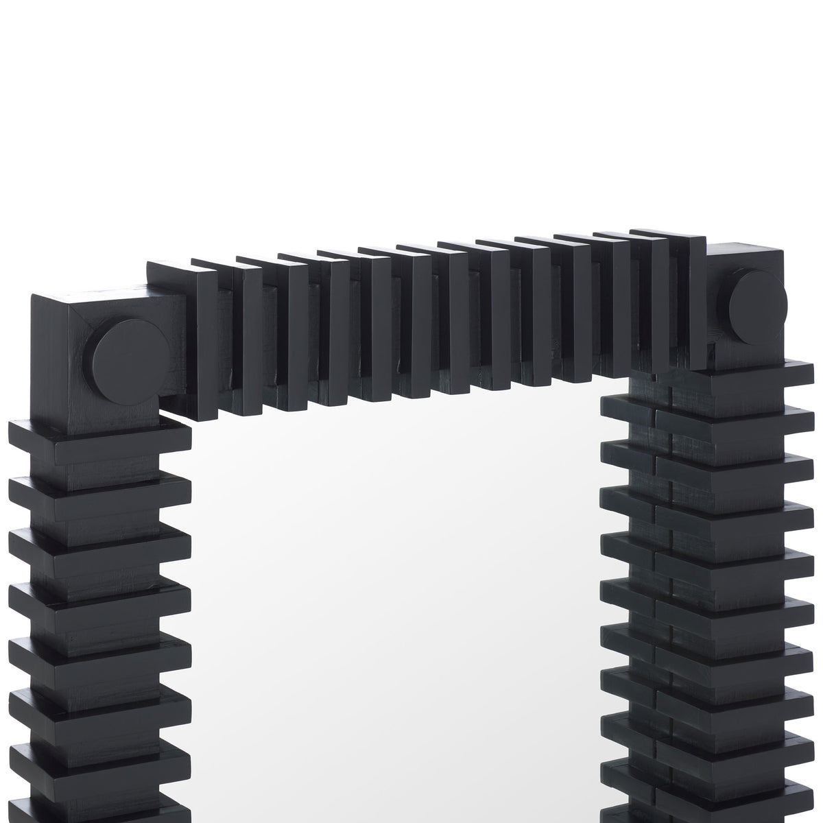 Layered black ridges and round corner accents give the mirror a sculptural profile.