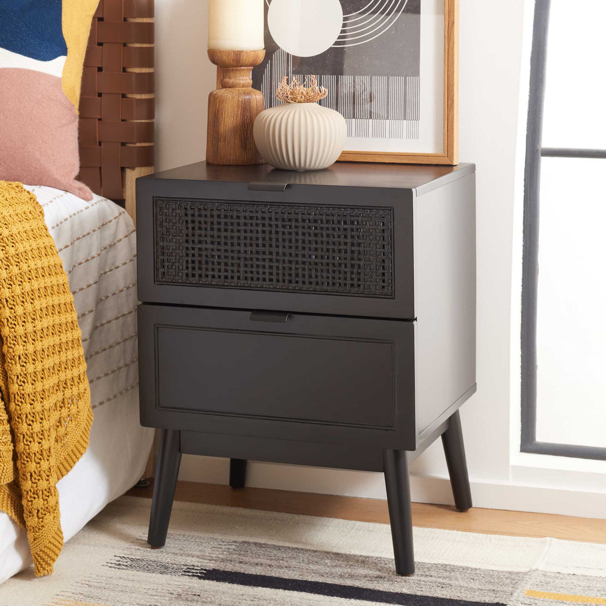 Black two-drawer nightstand brings coastal-modern style with rattan weave and tapered legs. || NST5003B || front_angle_room