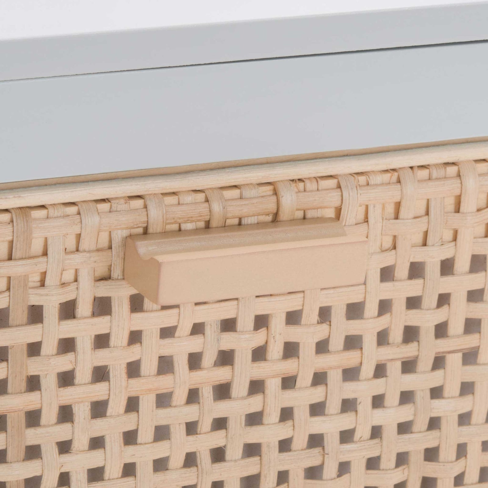 Streamlined wood pull complements the woven cane drawer front for subtle texture. || NST5012D || handle_studio