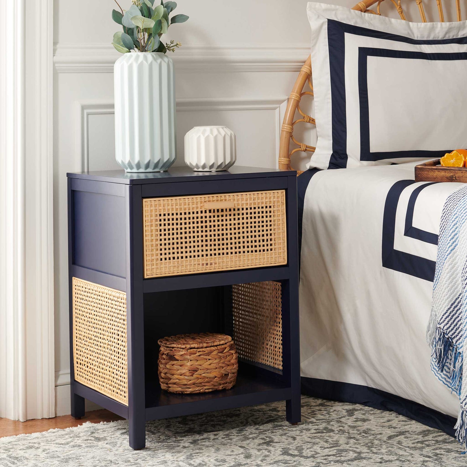Coastal-chic nightstand pairs navy wood with a woven rattan drawer and open shelf || NST5012E || front_angle_room