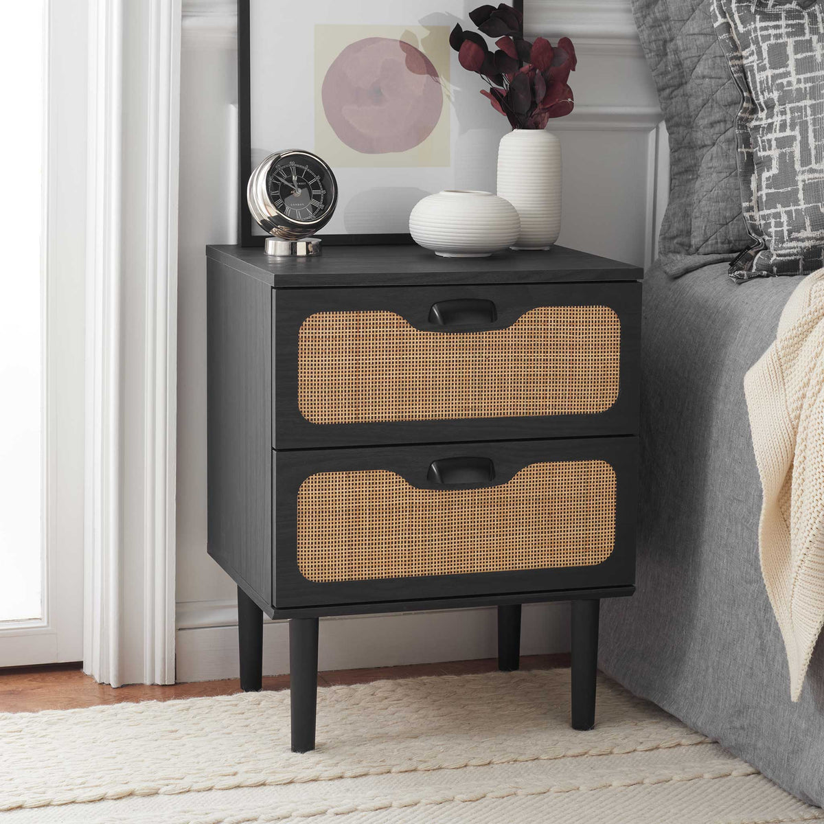 Timeless black and natural rattan nightstand brings warm texture beside the bed || NST9602B || front_angle_room