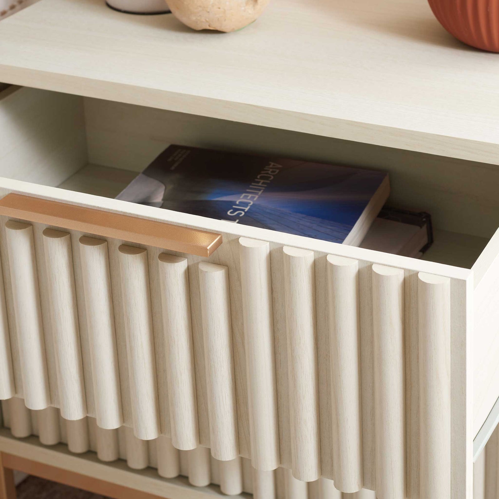 Fluted drawer front and slim handle bring texture and shine to the bedside. || NST9605C || storage_open_room