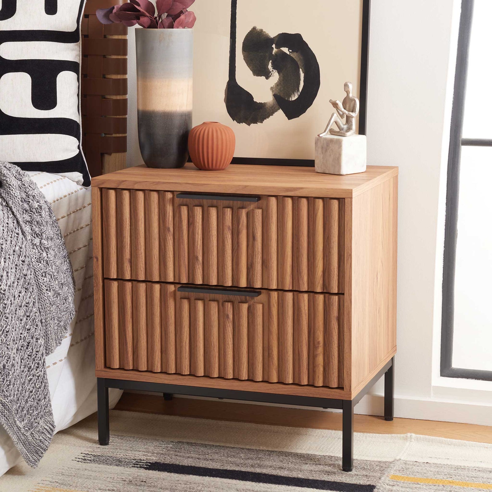 Modern fluted nightstand elevates the bedroom with warm oak tones and black accents || NST9605D || front_angle_room