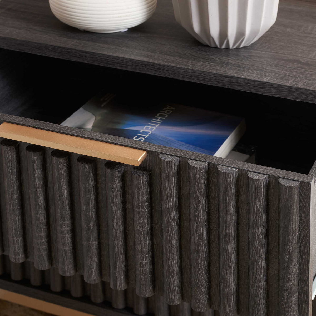 Open drawer reveals smooth, roomy storage beneath a textured fluted facade || NST9605E || storage_open_room