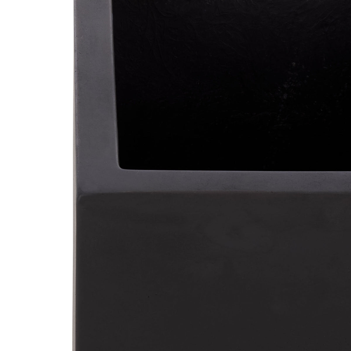 Thick black planter rim frames a deep, open planting well