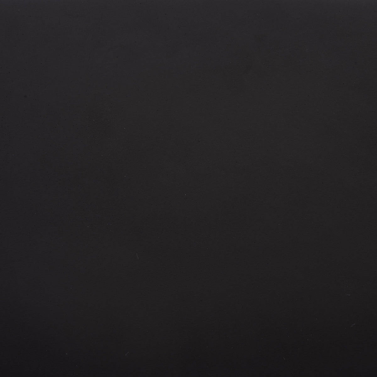 A rich black finish shows subtle shifts in tone across the fiberstone surface || PAT1403A || swatch_studio