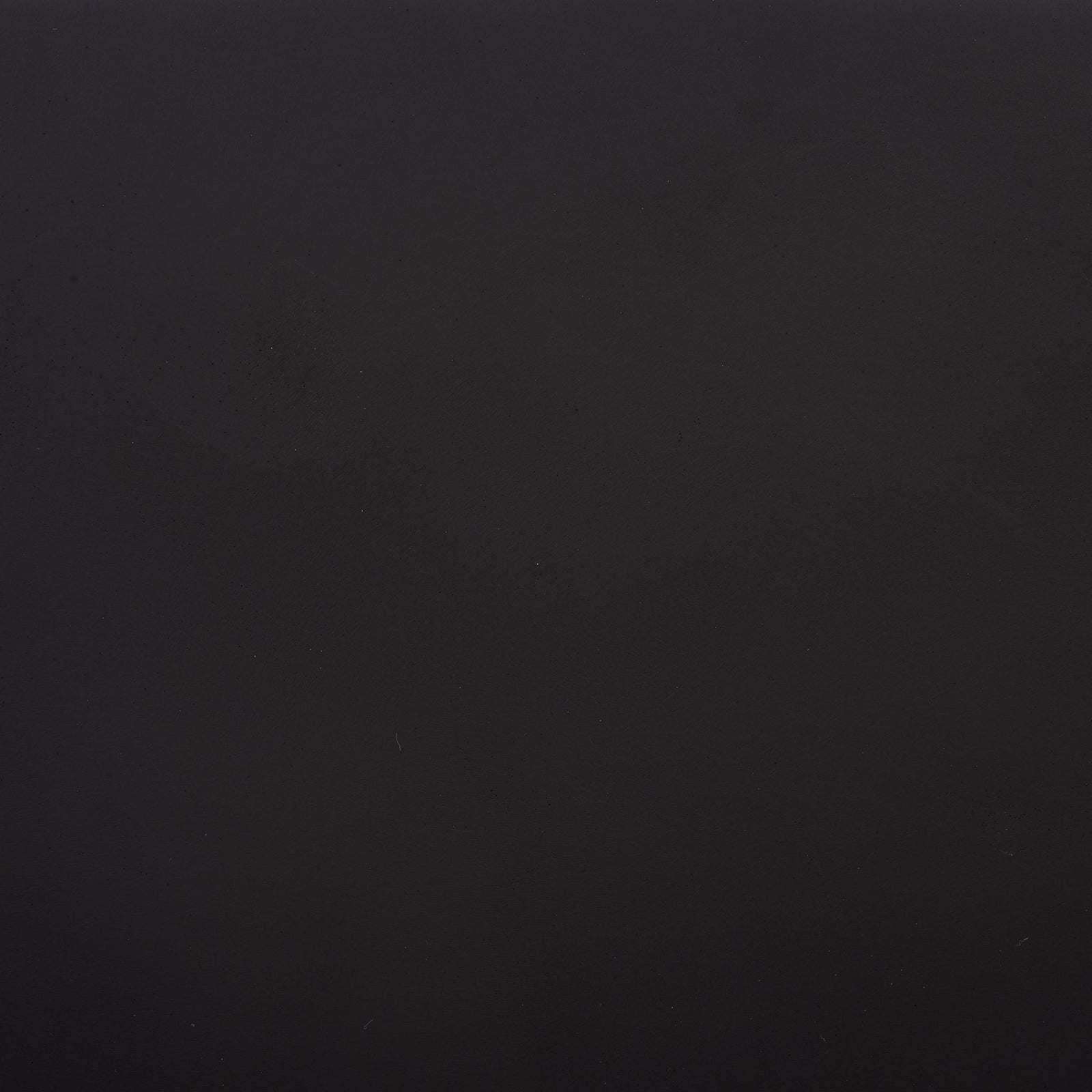 A rich black finish shows subtle shifts in tone across the fiberstone surface || PAT1403A || swatch_studio
