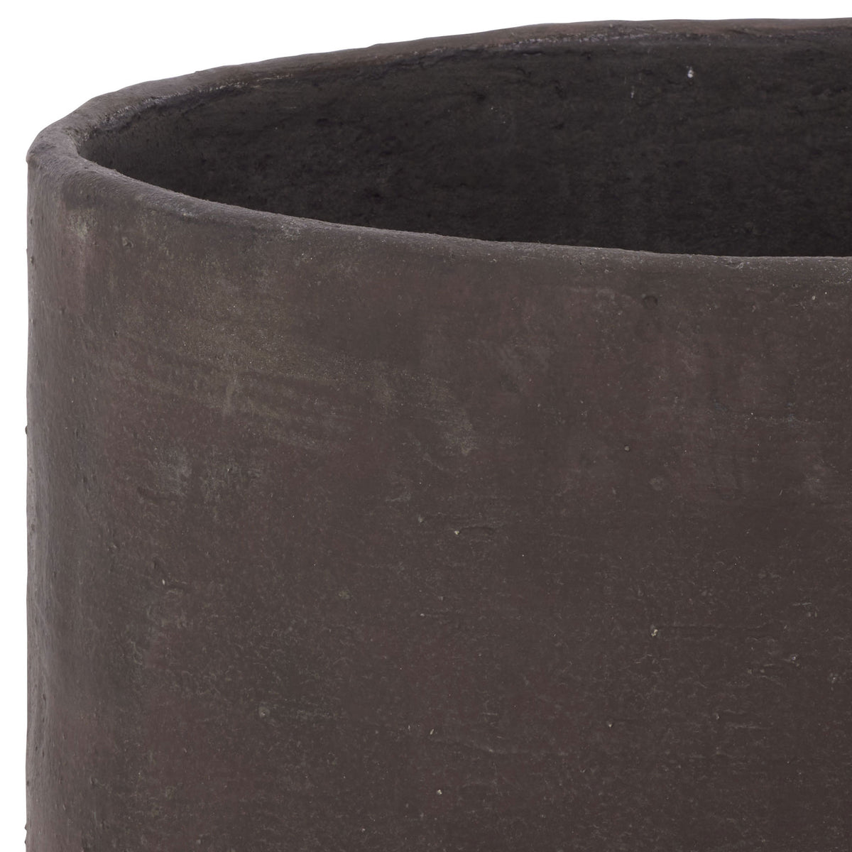 A gently uneven brown lip edges the broad opening of the large planter.