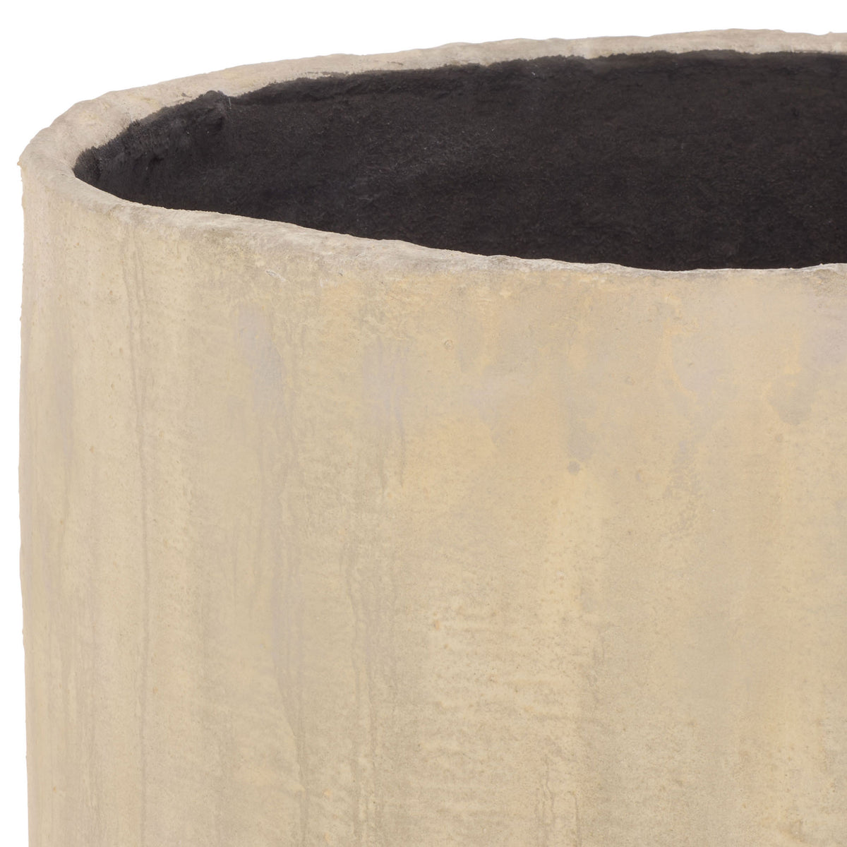 The large beige planter has a textured lip surrounding its dark inner cavity. || PAT1405B || detail_studio