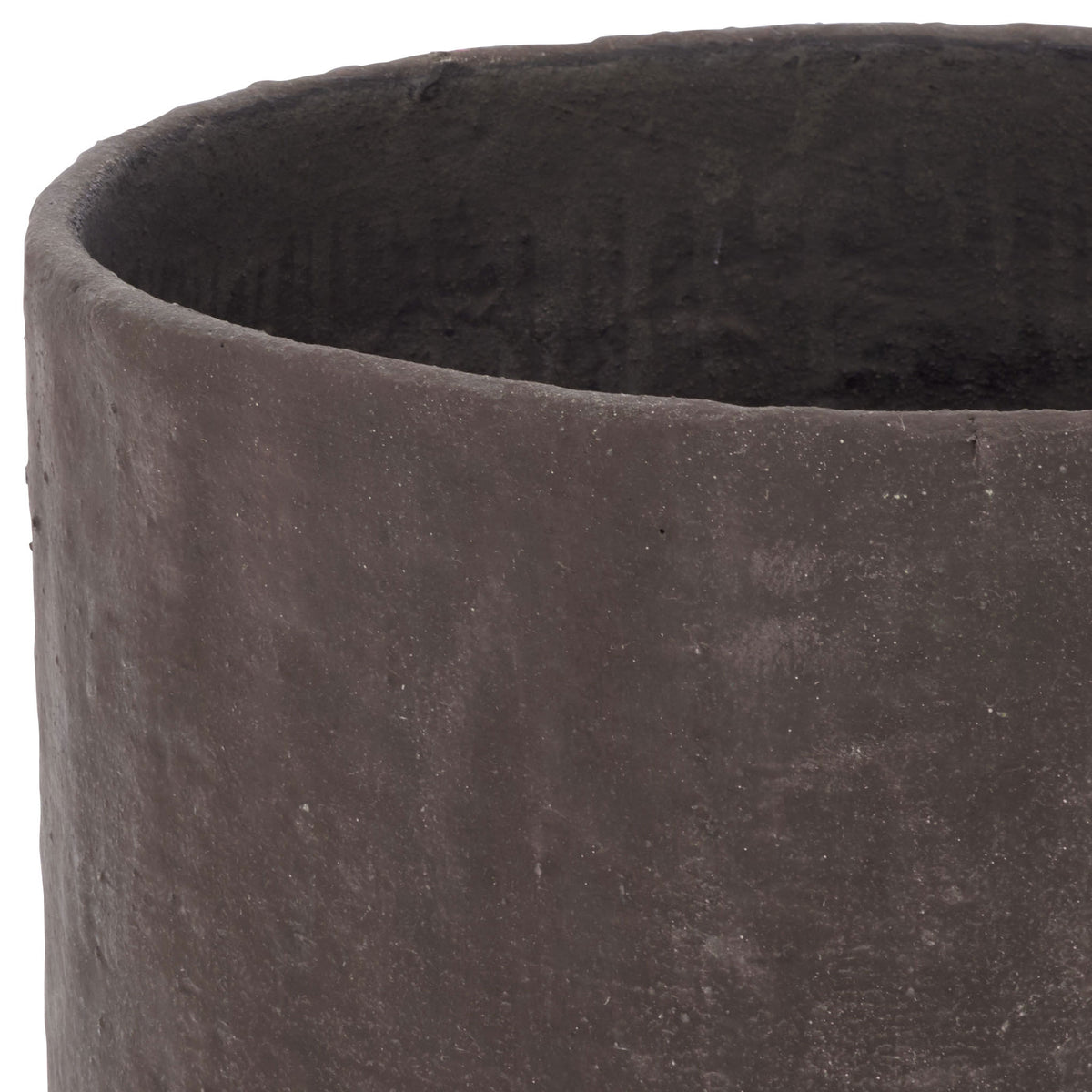 An uneven dark brown rim borders the planter's textured black interior. || PAT1408A || detail_studio