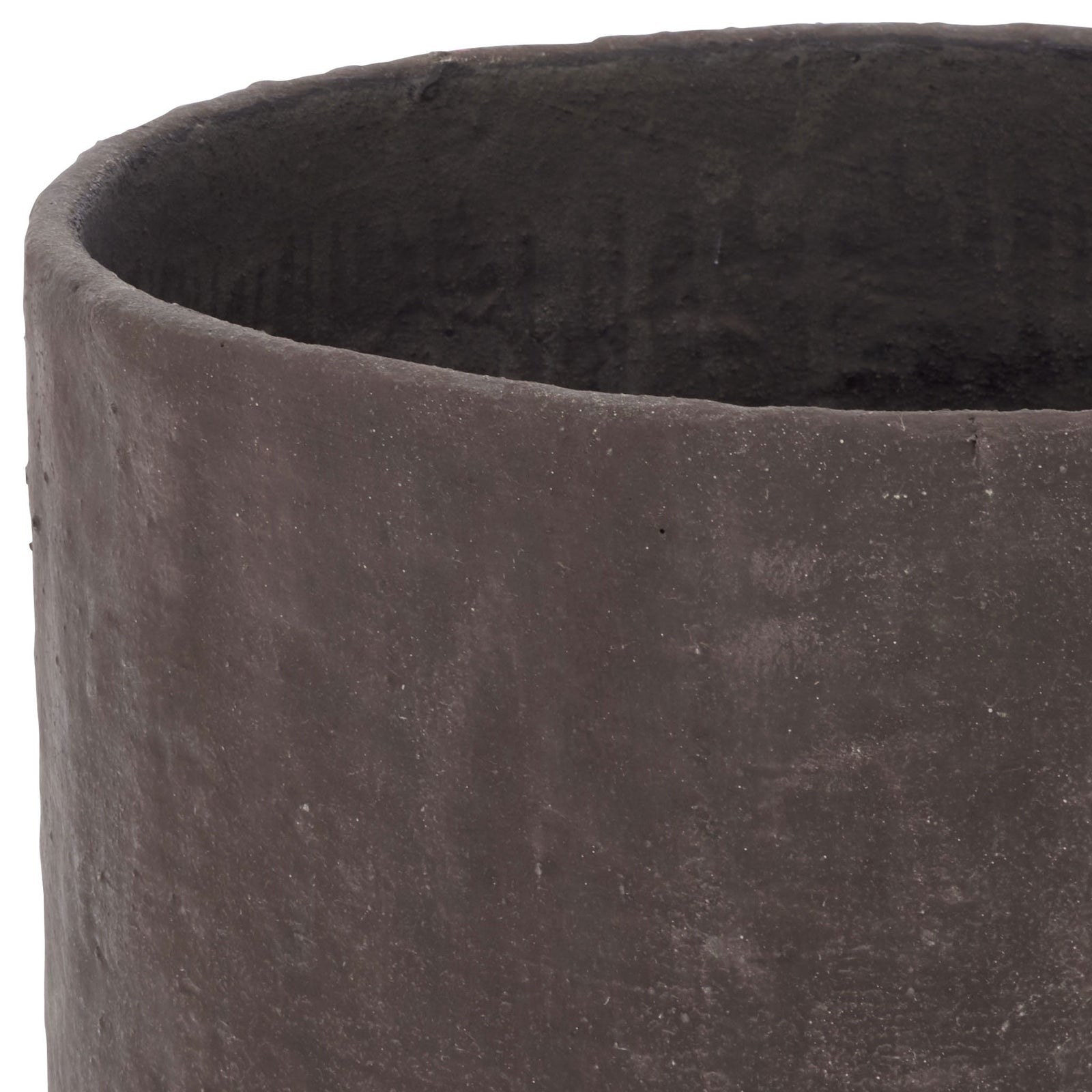 An uneven dark brown rim borders the planter's textured black interior. || PAT1408A || detail_studio