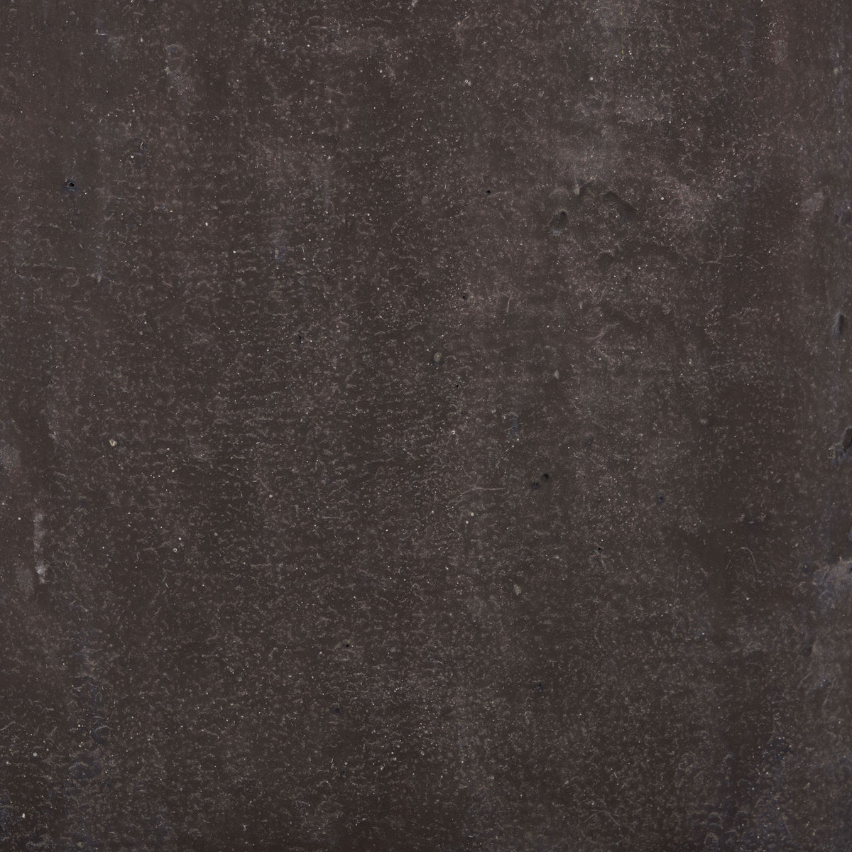 Brown surface displays subtle speckling and a matte, stone-like texture. || PAT1408A || swatch_studio