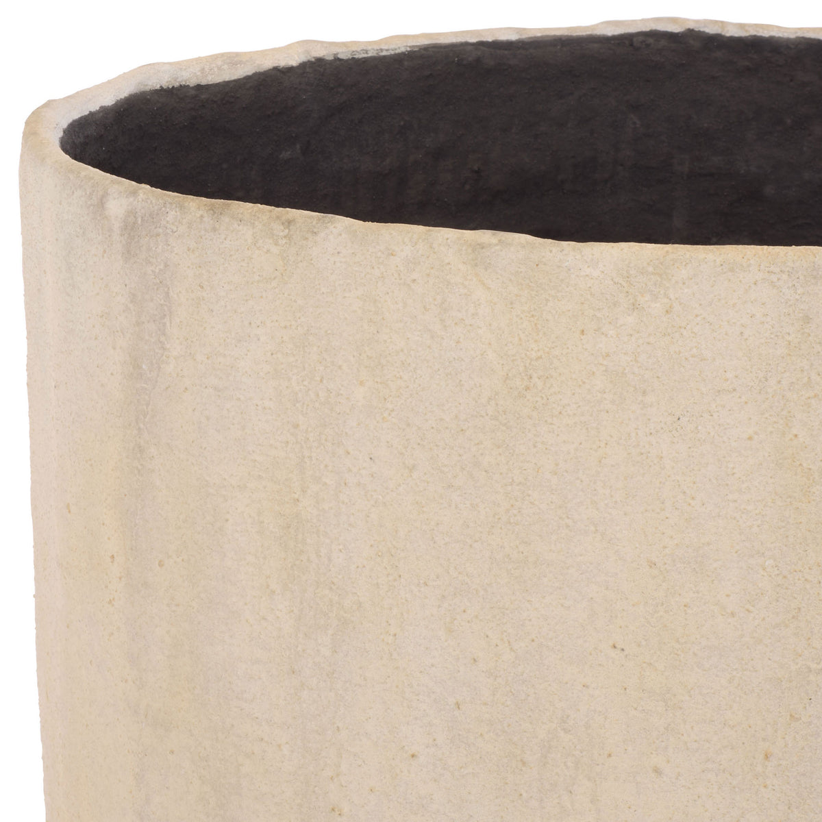 The large beige planter has a subtly textured rim and deep charcoal interior. || PAT1409B || detail_studio