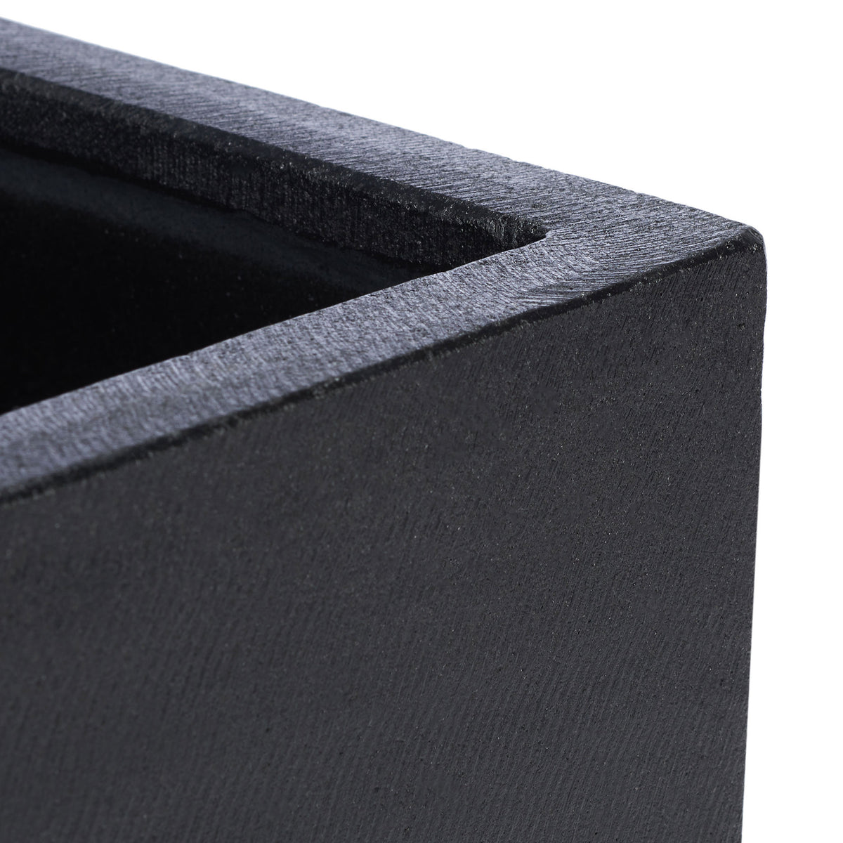 Textured black concrete and a substantial square rim give the planter a crisp, sculptural edge. || PAT1512A || detail_studio