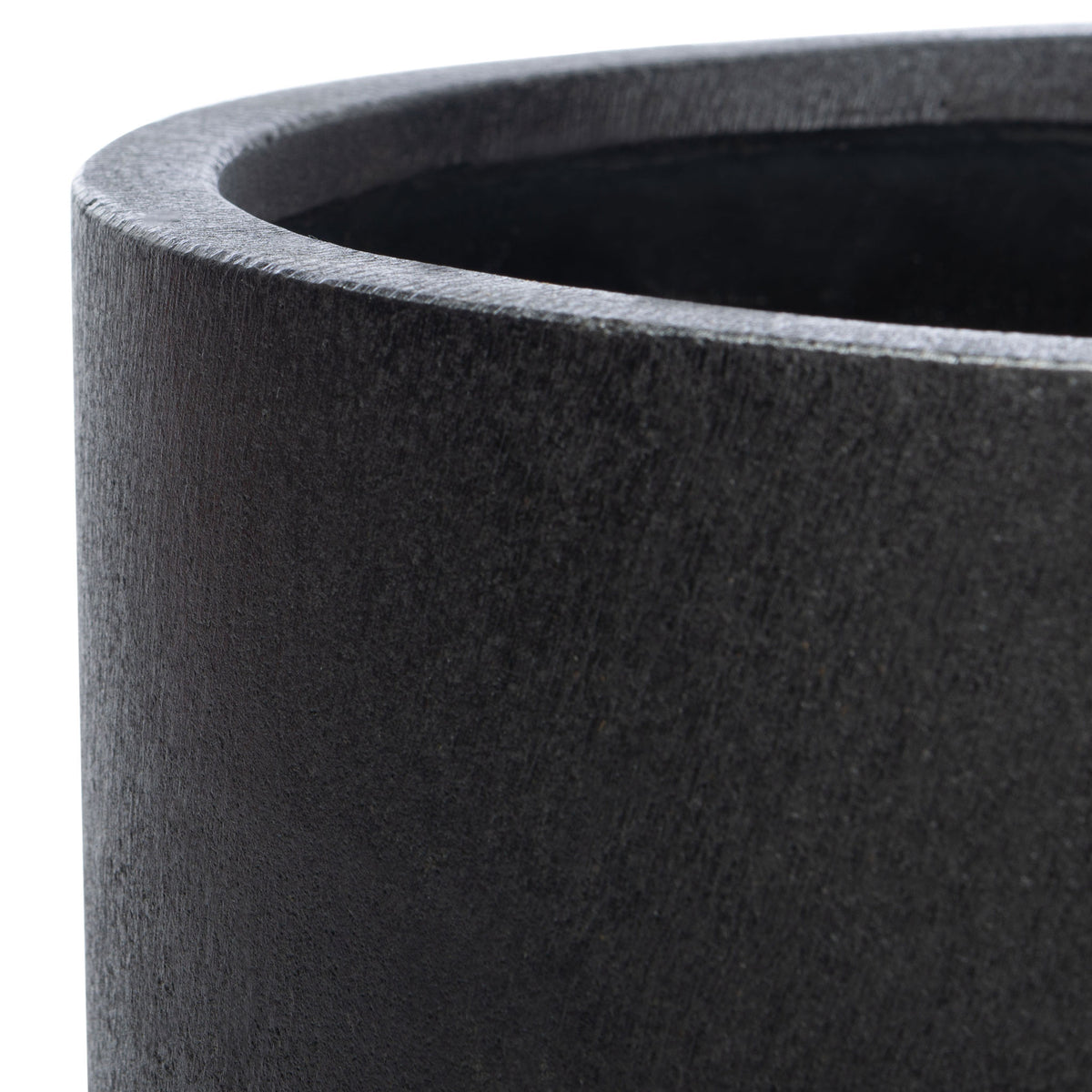A rounded rim and subtly textured black surface give the planter a clean, modern look.