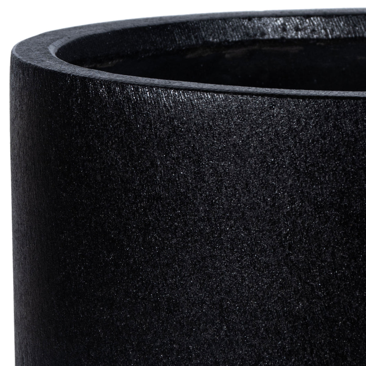 Fine stone-like texture and a softly rounded lip define the black planter