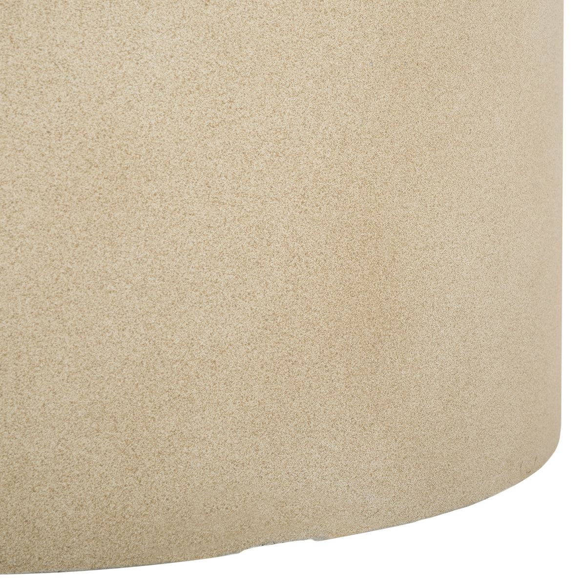 The beige planter's gently curved base continues its fine-grained stone texture