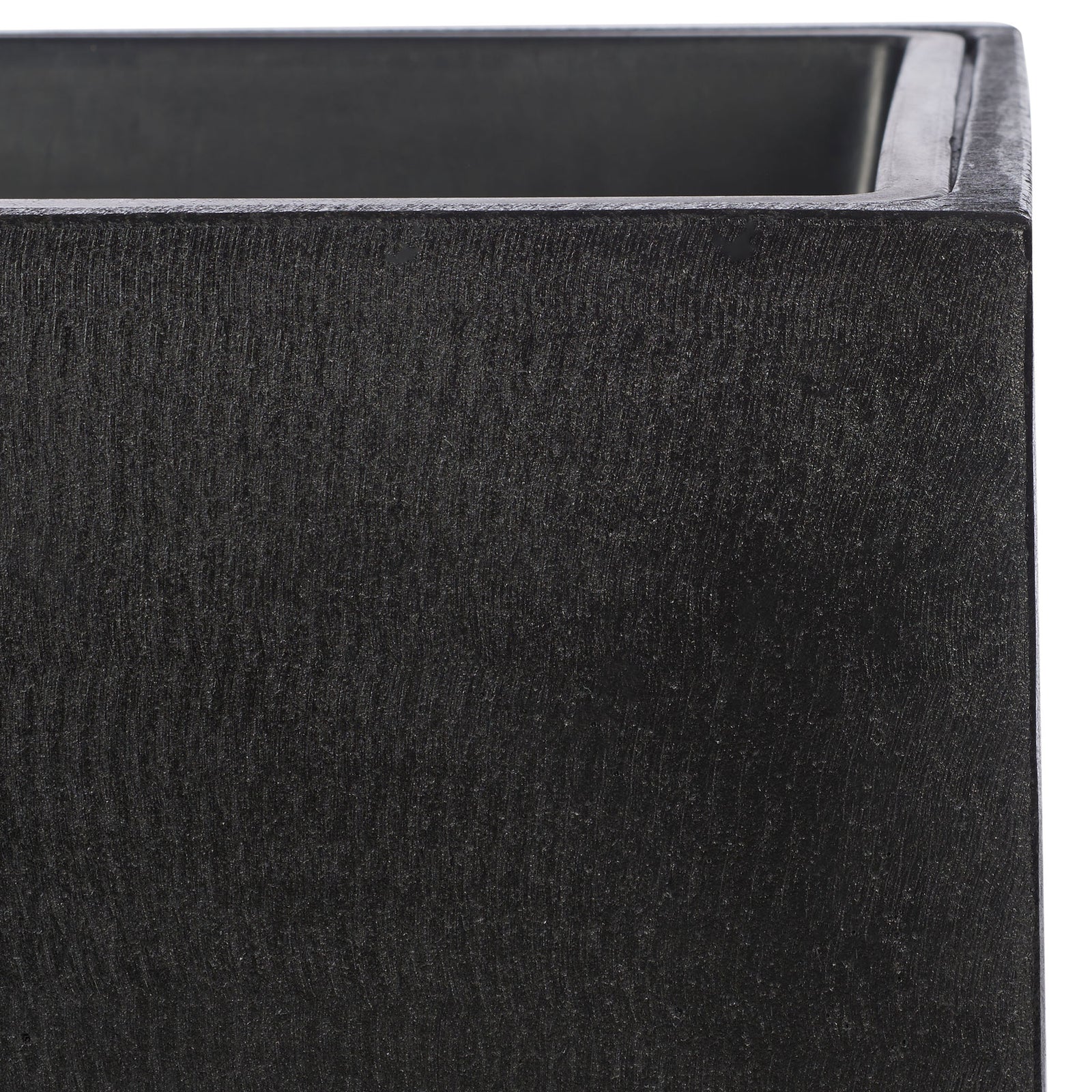 A fine black texture adds depth to the planter's clean square rim and minimalist sides. || PAT1521A || detail_studio