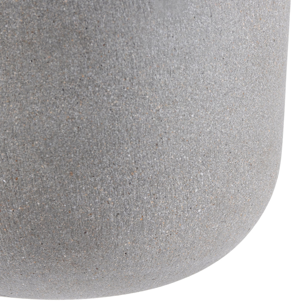 The light gray planter curves into a rounded base with fine stone-like texture.