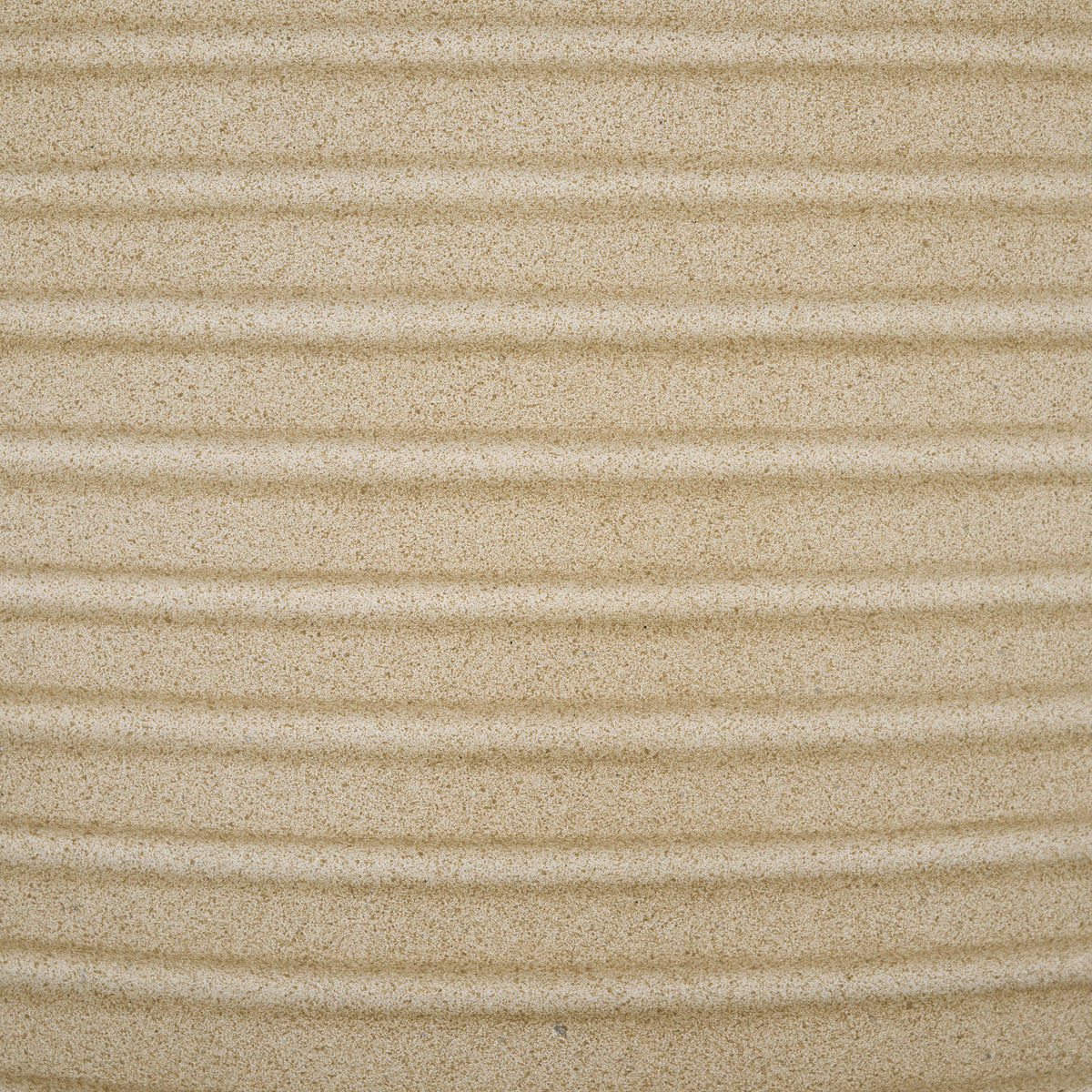 A warm beige, sandlike texture accentuates the planter's evenly spaced raised ribs || PAT1530B-SET2 || swatch_studio