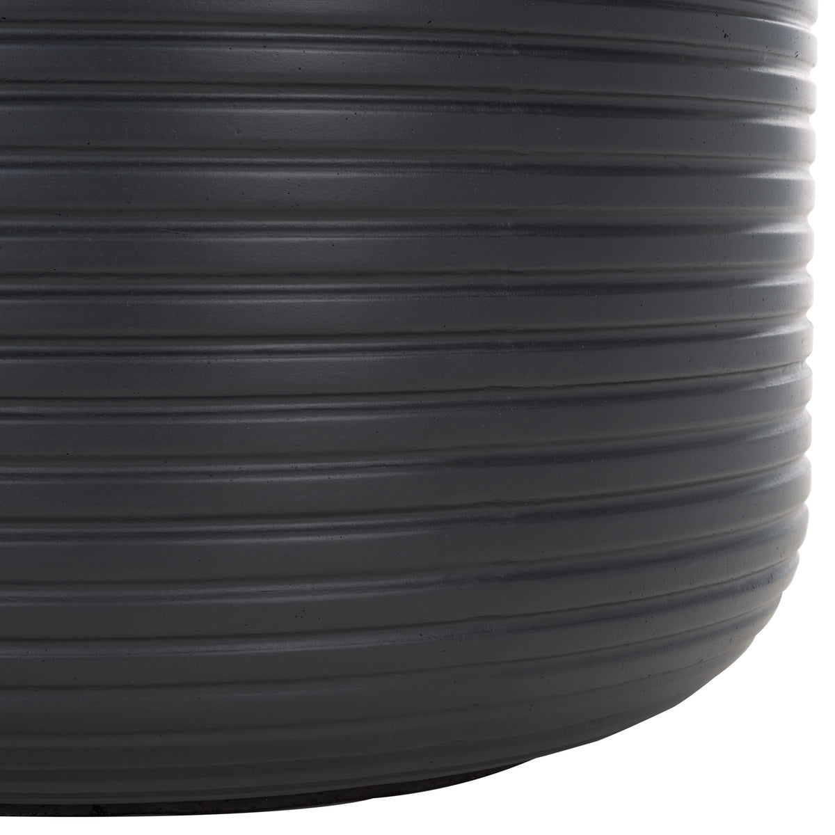 The black planter's curved base and layered horizontal ribs create a sturdy modern silhouette || PAT1531A || leg_studio