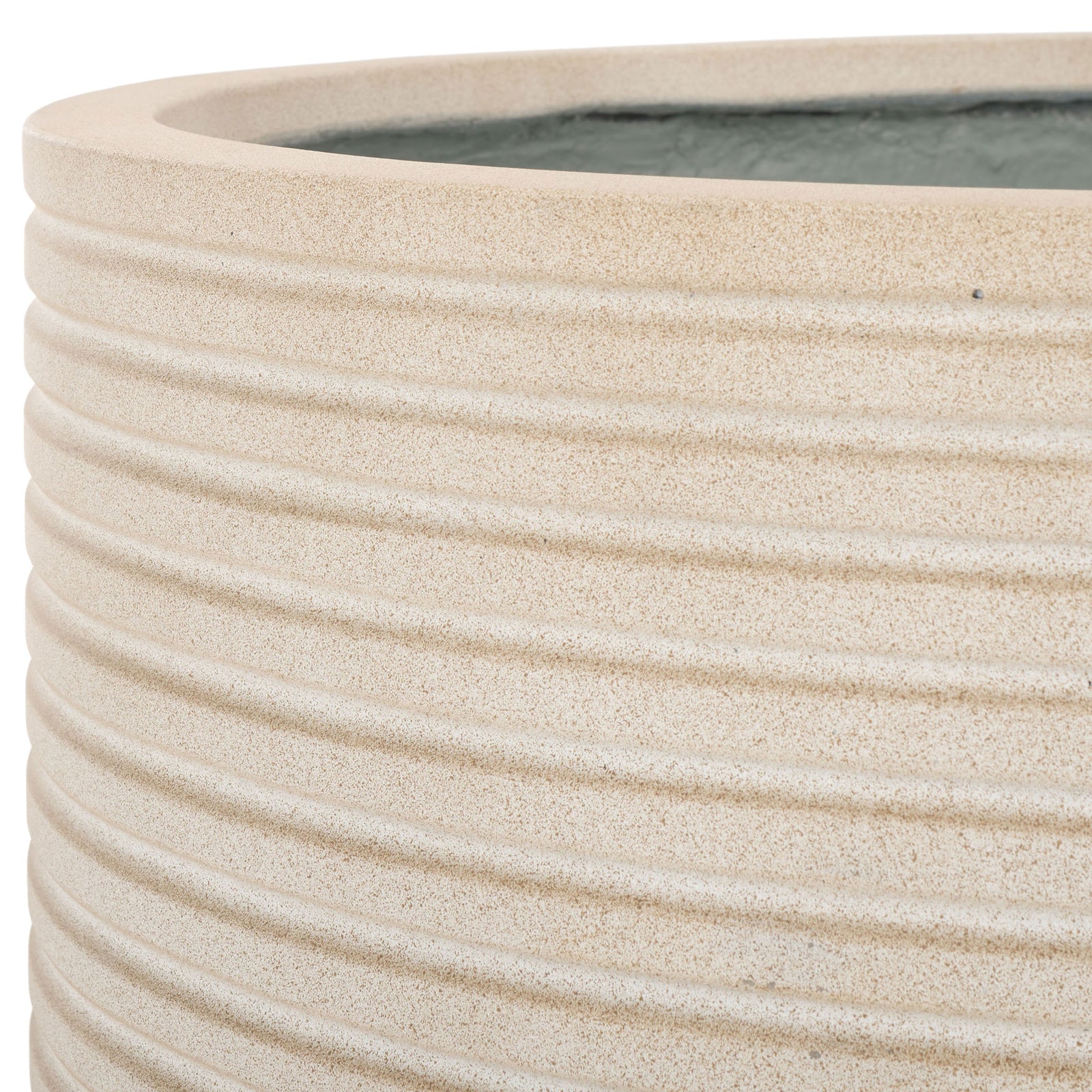 A generous beige rim and fine, stacked ribs bring soft texture to the planter's rounded form || PAT1531B || detail_studio
