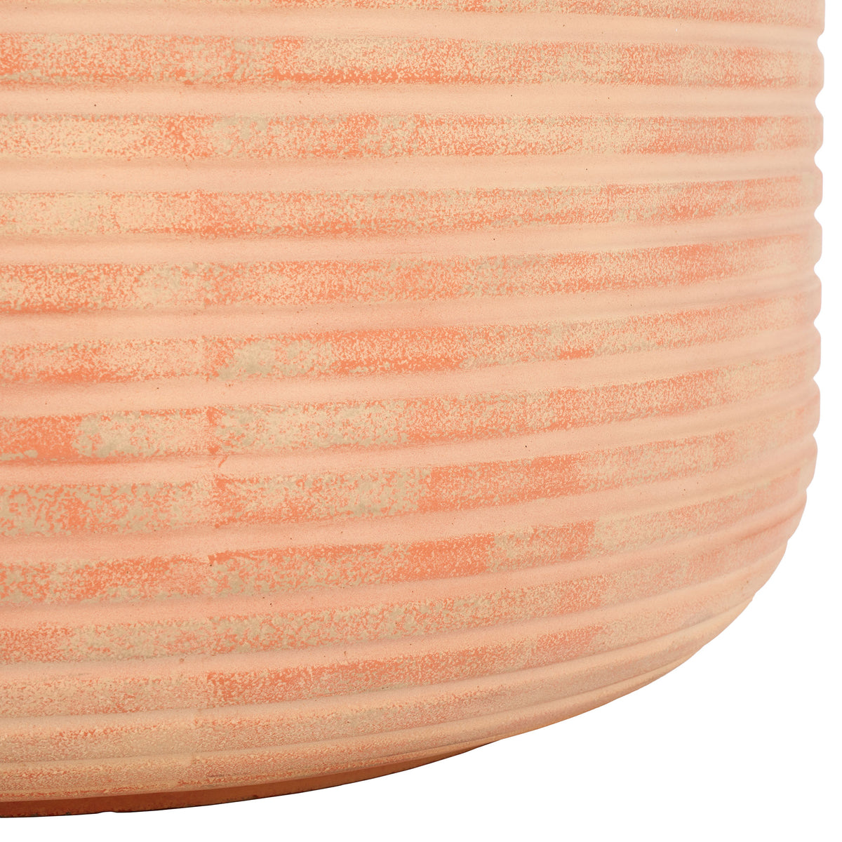 The planter's warm terracotta finish and rounded base complement its pronounced horizontal ridges || PAT1531D || leg_studio