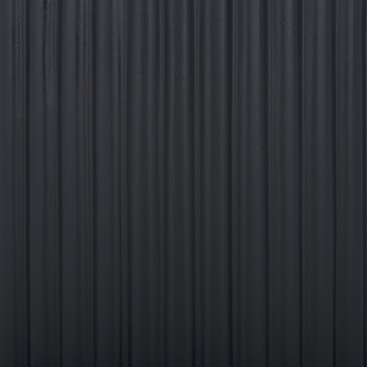 Closely spaced black ribs lend the surface a subtle play of light and shadow. || PAT1532A-SET2 || swatch_studio