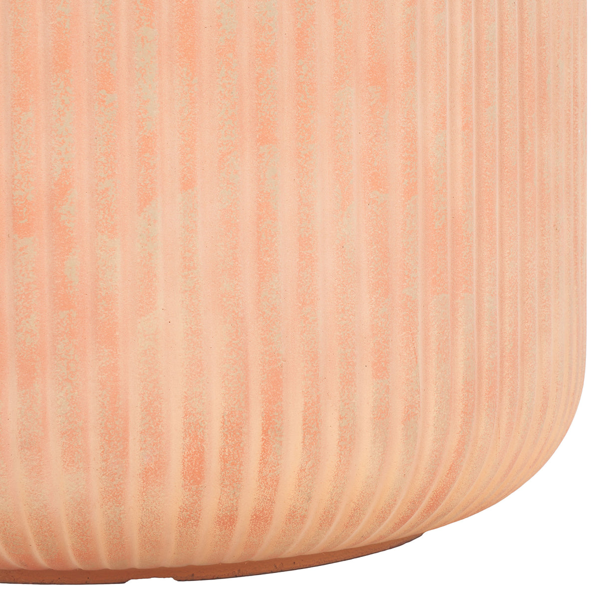 Ribbed terracotta walls taper into a rounded base with a slim resting edge.