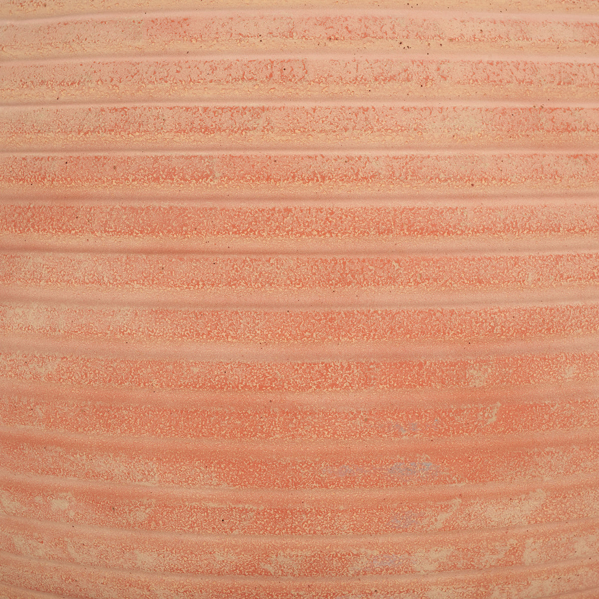 Soft orange and pale clay tones enliven the terracotta planter's raised grooves. || PAT1534D || swatch_studio