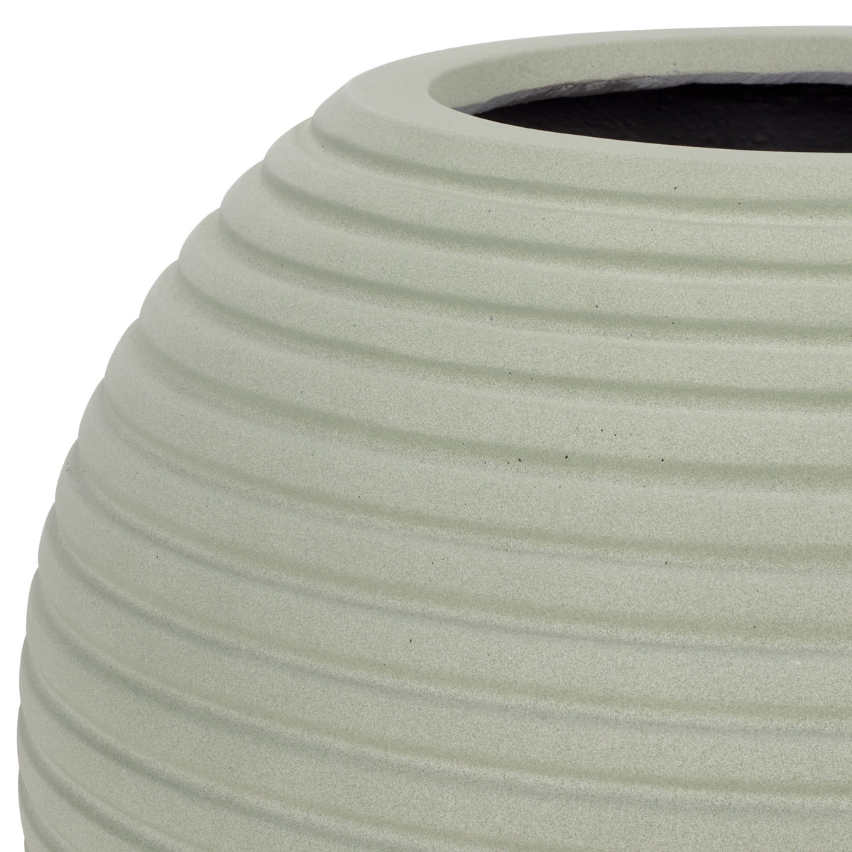 Soft sage finish brings out the rounded lip and sculpted grooves of the planter. || PAT1534E || detail_studio