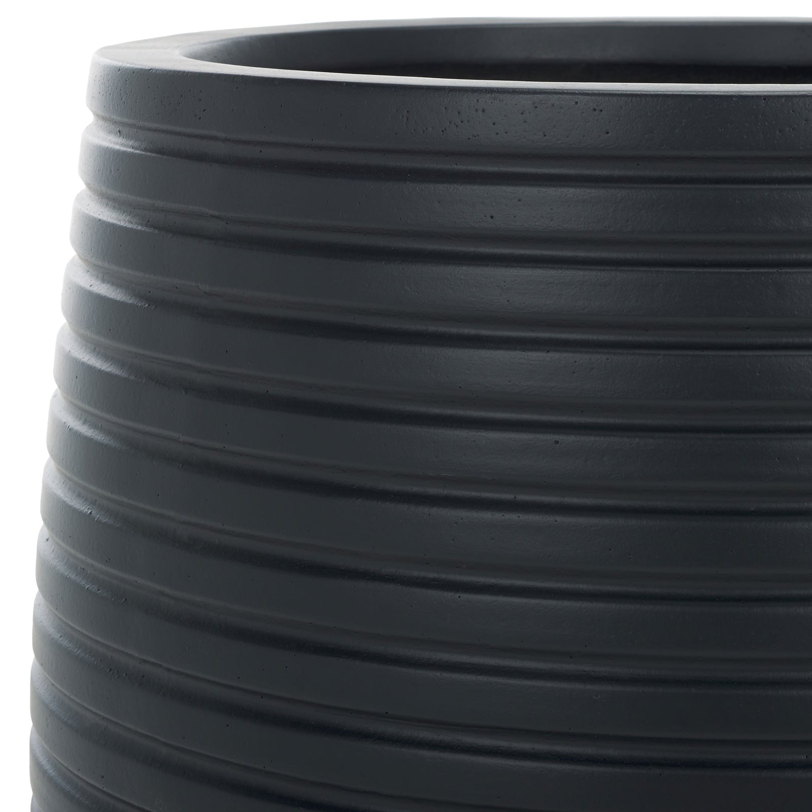 A deep black finish highlights sculpted ridges around the planter's upper edge || PAT1535A-SET2 || detail_studio