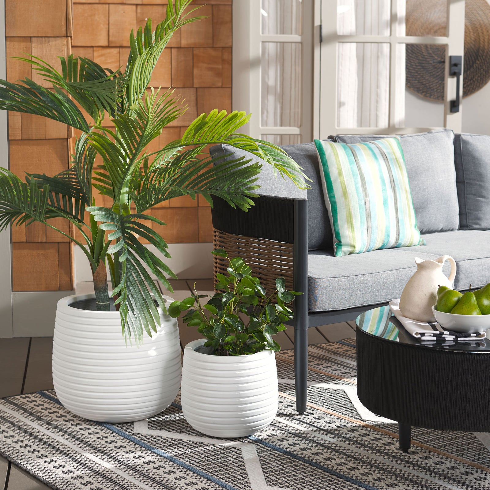 White ribbed planters brighten a leafy seating area with clean texture || PAT1535C-SET2 || front_angle_room