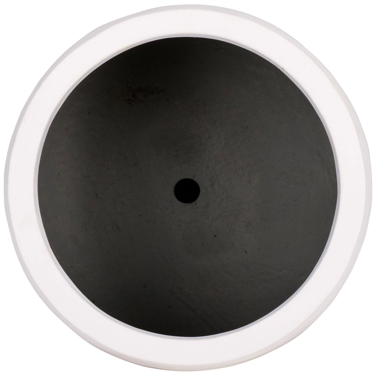 The white planter has a wide circular opening and a central drainage hole. || PAT1542C || top_studio