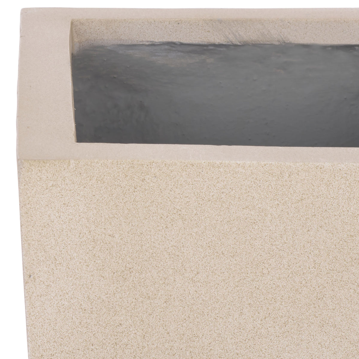 A sandy beige rim frames the planter's recessed dark interior and softly textured exterior. || PAT1543B || detail_studio